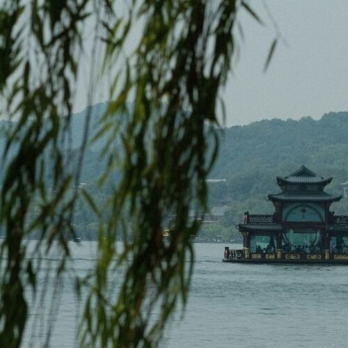 Boats and floating building on West Lake, Hangzhou, China